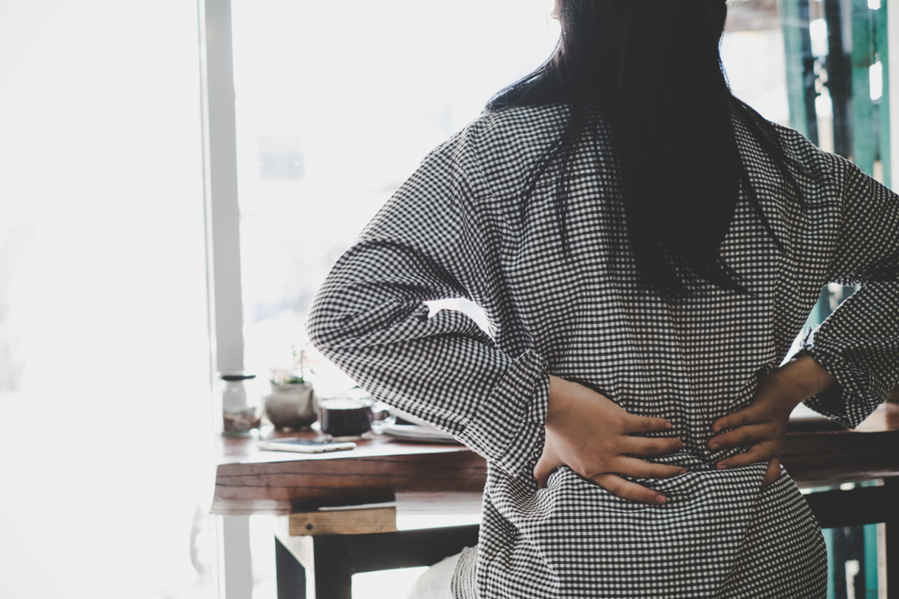 Businesswoman,suffering,from,pain,of,lower,back